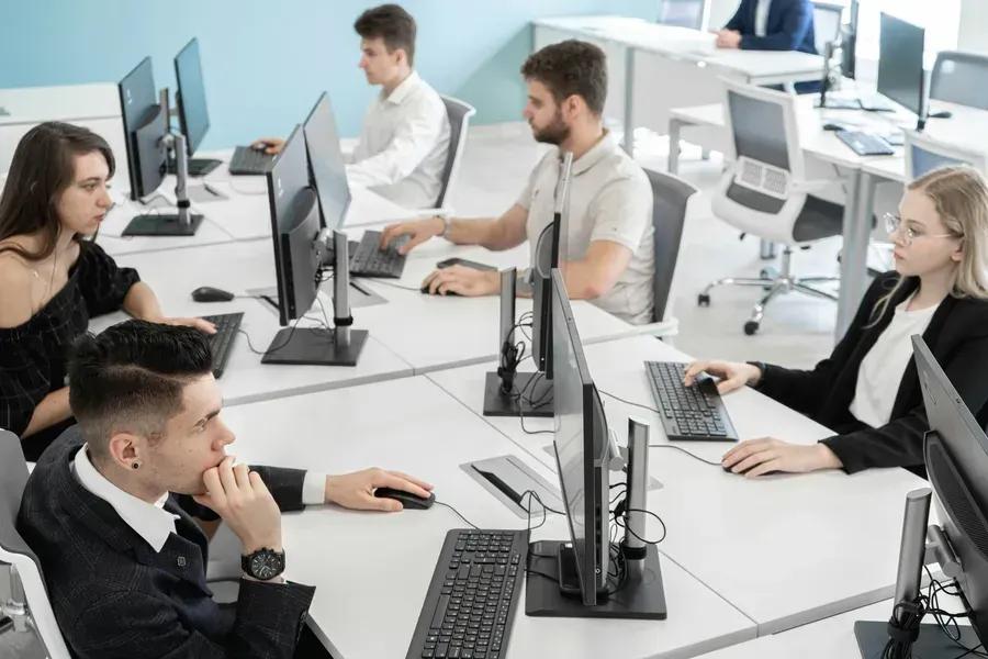 Enterprise workers are dealing with tasks in an open space type office
