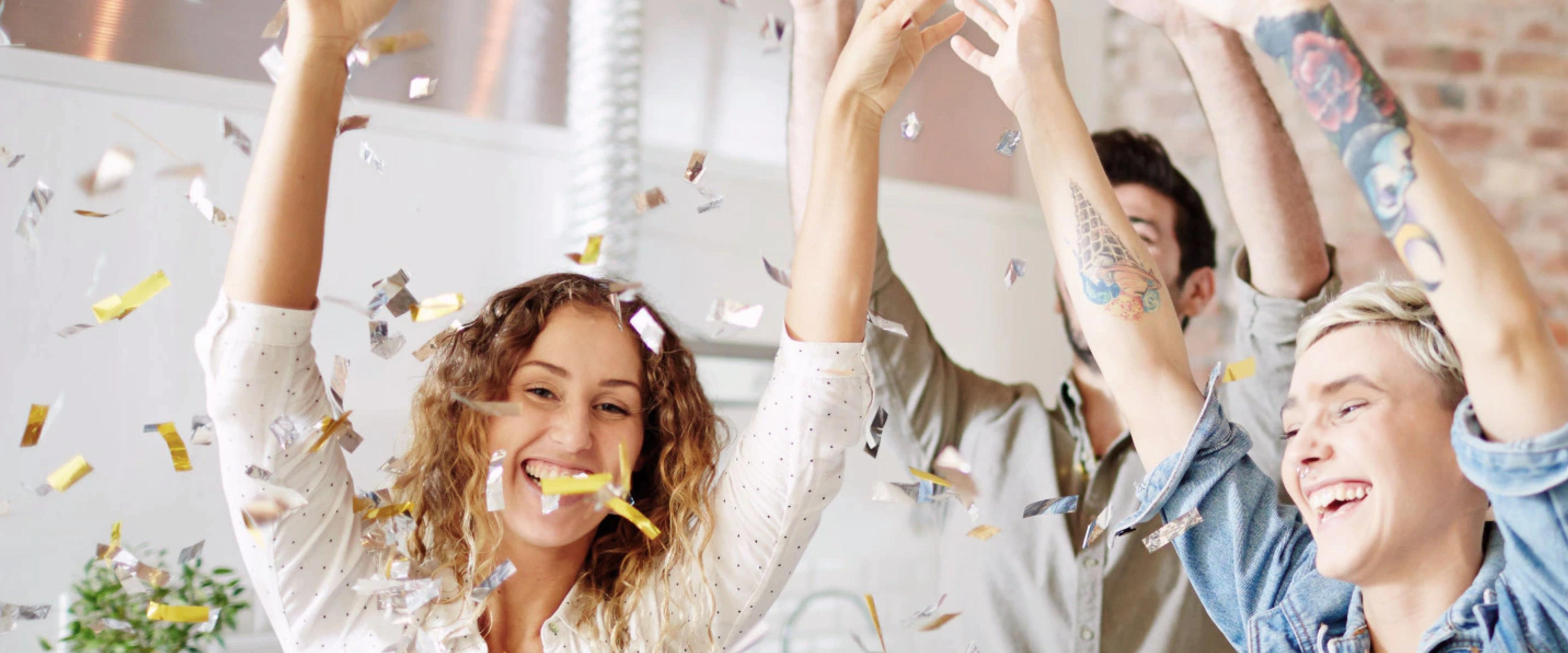 People celebrating some holiday in the kitchen