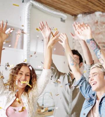 People celebrating some holiday in the kitchen