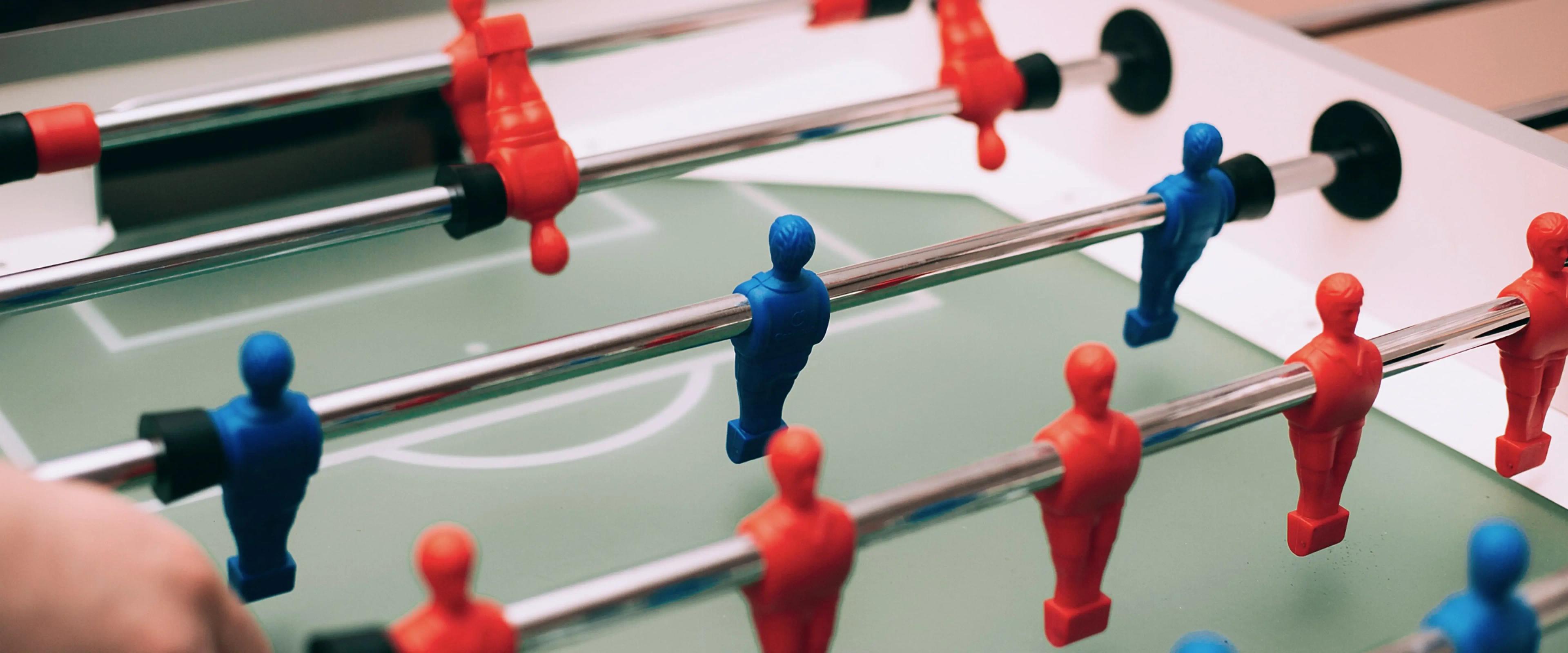Close-up of table football with red and blue pieces