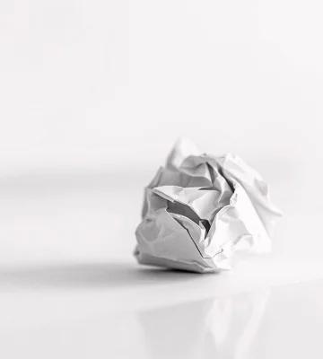 Crumpled paper on white table